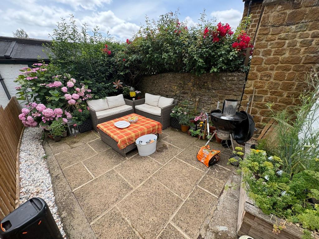 Finished garden patio with surrounding borders